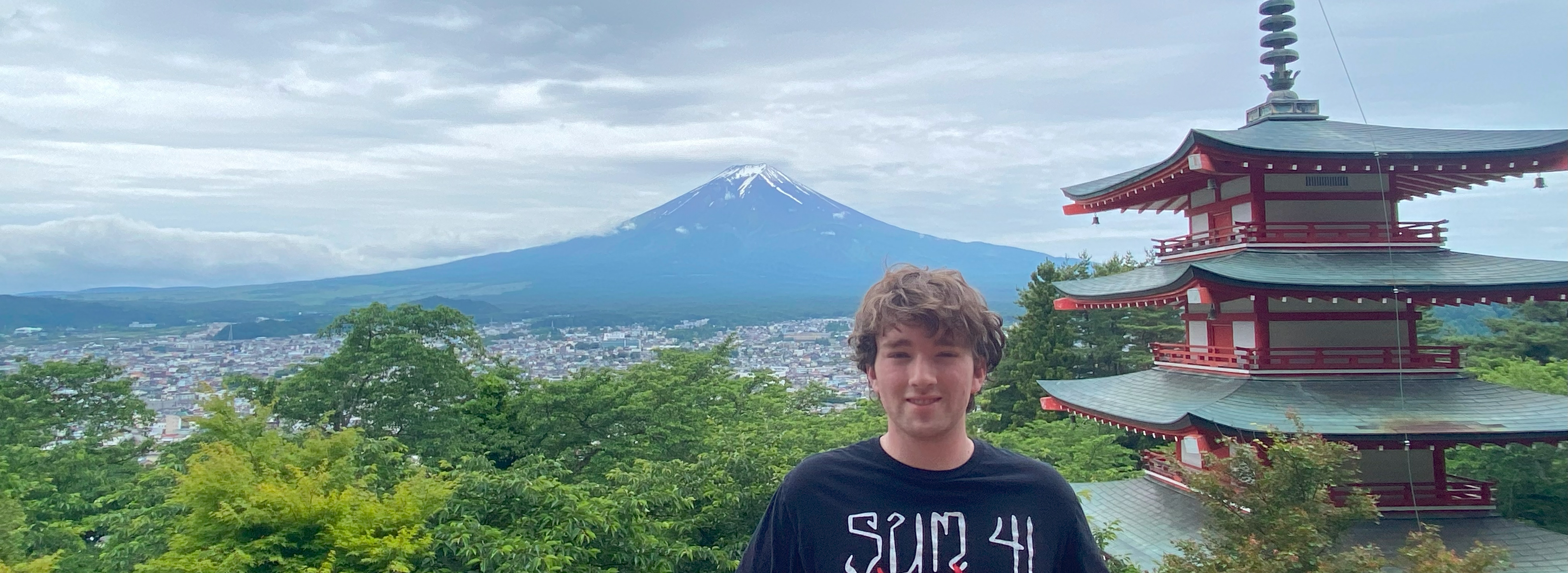 A photo showing me standing in front of Mt Fuji.